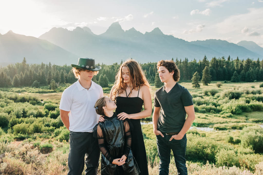 Sibling portrait by mountain