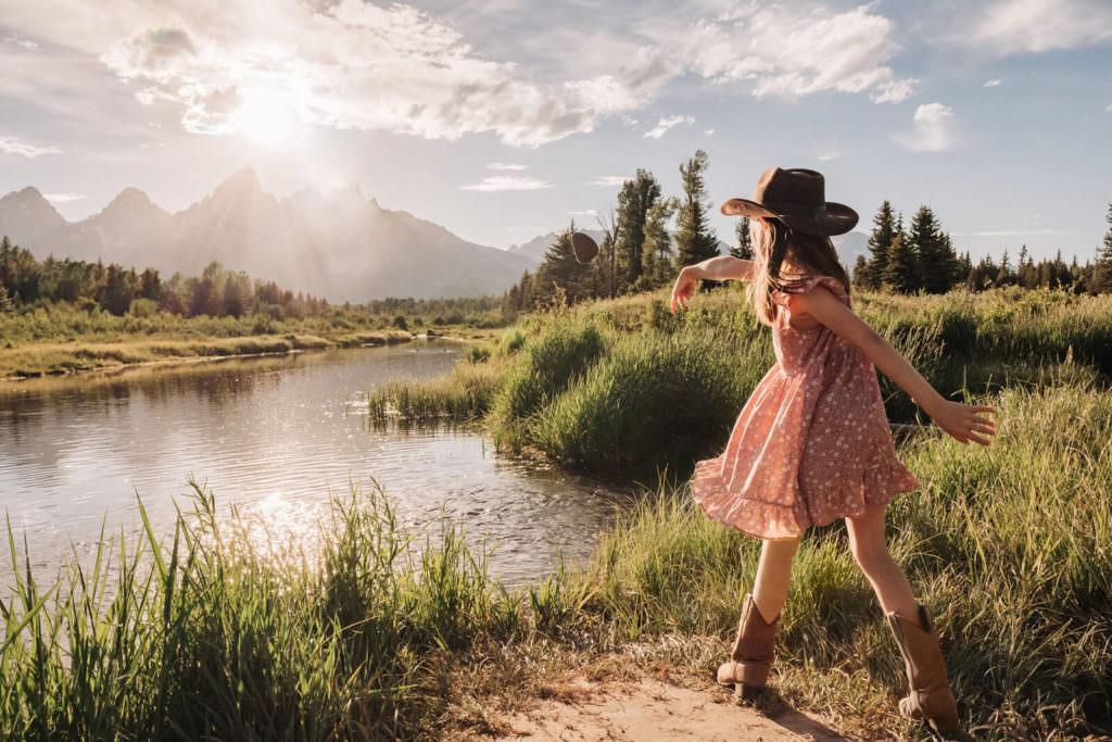 Erion Daughter Throwing Rocks in River