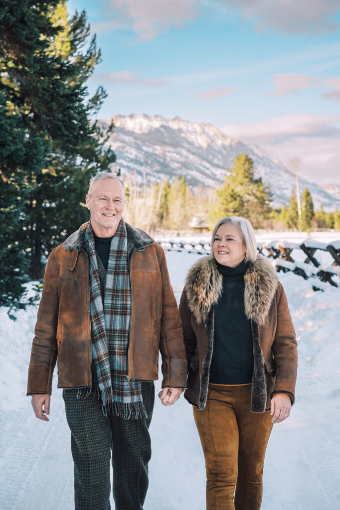 outdoor winter couple photoshoot in Jackson Hole, family photo outfits for winter, earth-toned palate outfit inspiration