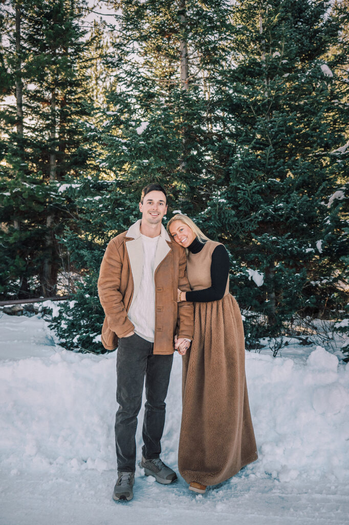 outdoor winter couple photoshoot in Jackson Hole, family photo outfits for winter, earth-toned palate outfit inspiration