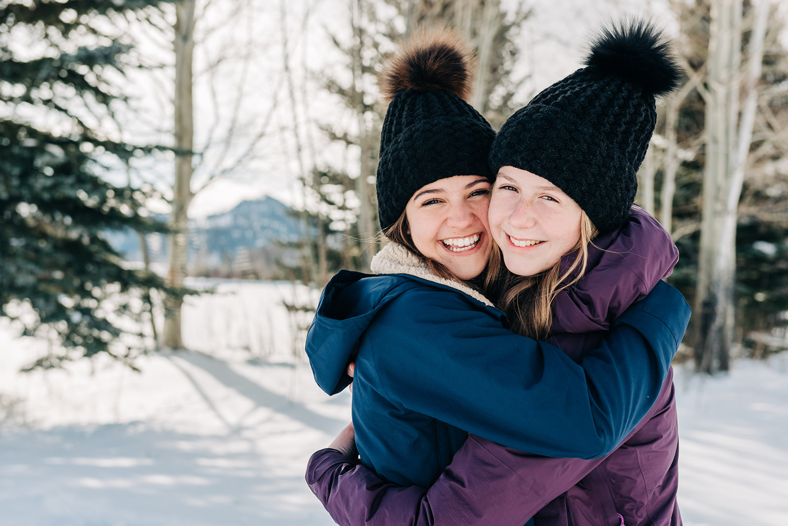 girls dressed in winter outfits for a family session